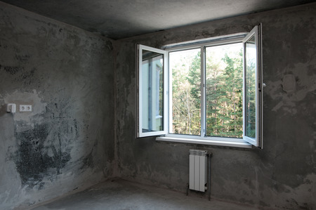 opened window in a new apartment without repairの写真素材