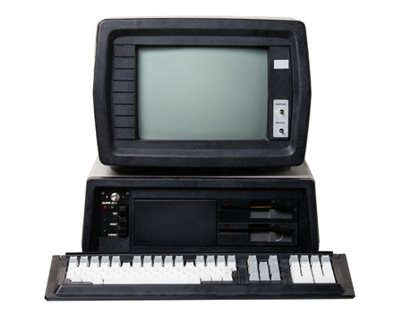 Old personal computer. The system unit, monitor and keyboard isolated on white background.の写真素材