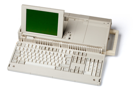 Old portable personal computer, isolated on white background