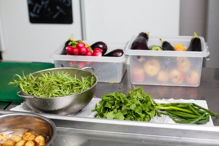 Cooking preparation - fresh vegetables and greenery on the tableの写真素材