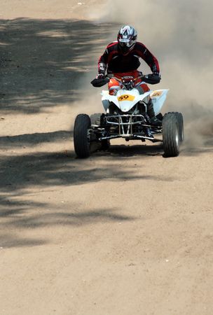 Man on quad bike durin a raceの写真素材