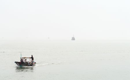some boats in the fog - vietnamの写真素材