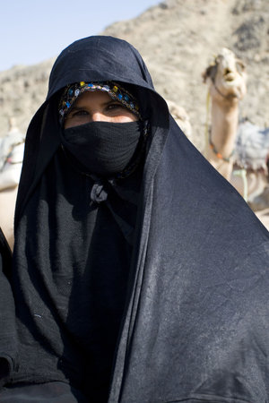 HURGHADA, EGYPT - AUGUST 4: Portrait of old Arabian woman wearing a black head covering on August 4, 2010 in Hurghada, Egypt. Hurghada is a very popular health resort for tourist from Europe. のeditorial素材