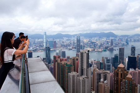 HONG KONG - JULY 15, 2017: cityscape from the Peak. The most popular point for taking a photo of Hong Kongのeditorial素材