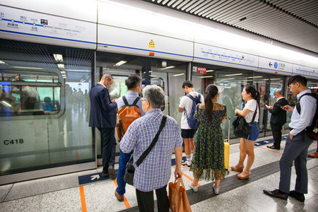 HONG KONG - JULY 15, 2017: People traveling in the subway. Metro MRT is the most popular form of public transportation in Hong Kong.のeditorial素材