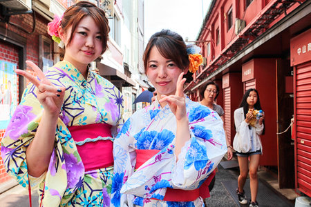 Tokyo, Japan - August 10, 2016: Modern japanese girls in traditional kimono on the way to the temple, Asakusa districtのeditorial素材