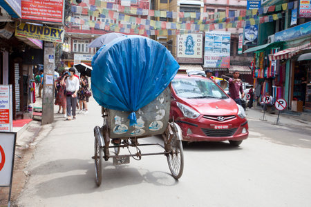 KATHMANDU, NEPAL - JULY 17, 2018: Street in the Thamel district, Kathmandu. Thamel is a tourist...