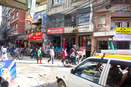 KATHMANDU, NEPAL - JULY 17, 2018: Street in the Thamel district, Kathmandu. Thamel is a tourist...