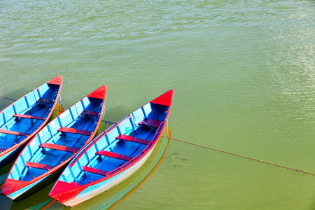Small wooden boats on the Phewa Lake in Pokhara, Nepalのeditorial素材