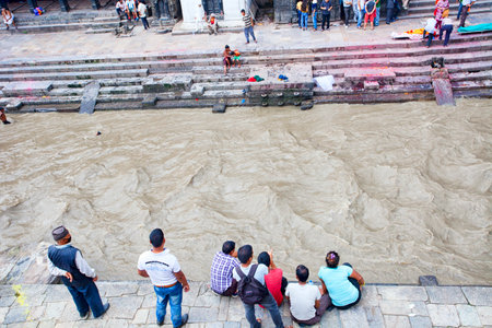 KATHMANDU, NEPAL - JULY 12, 2018: Temple of the Pashupatinath crematorium. People believe that...