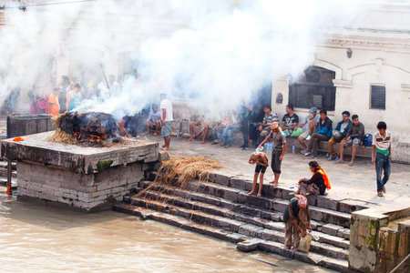 KATHMANDU, NEPAL - JULY 12, 2018: Temple of the Pashupatinath crematorium. People believe that cremation will give a spiritual rebirthのeditorial素材
