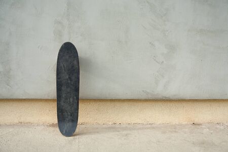 Skateboard on a wall. Used skateboard.の写真素材