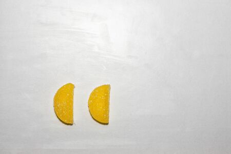 Two Sugar candies shaped as half moon.の写真素材