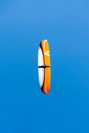 A low angle shot of a paraglidingの写真素材