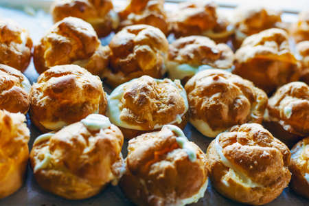 The iconic cream puffs, beloved pasterie filled with vanilla.