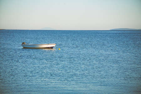 Small wooden fishing boat moored on a sea near Vir, Croatia.