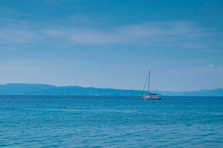 Small yacht in the adriatic sea near Kostrena, Croatia.