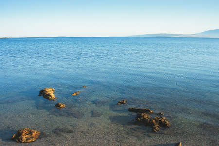 Beautiful coast, blue sea and mountains in the distance. Nice view of the blue Adriatic sea during a...