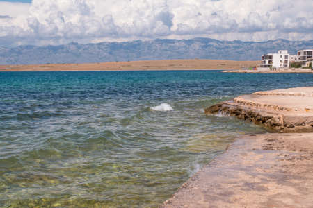 Beautiful coast, blue sea and city Vir in the distance. Nice view of the blue Adriatic sea during a...