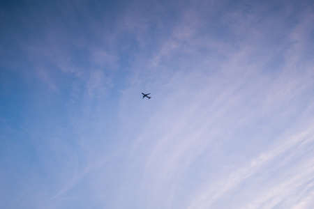Little white plane on a background of the blue summer sky.の写真素材