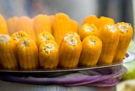 boiled corn  with smokeの写真素材