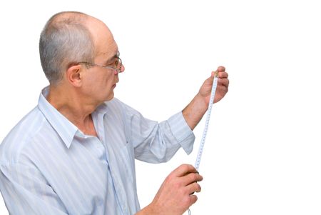 mature man in glasses with  tape-measure isolated on whiteの写真素材