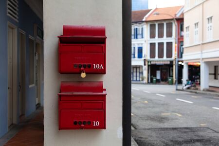 red mailboxes in the background of the old city of Singapore Asiaの写真素材