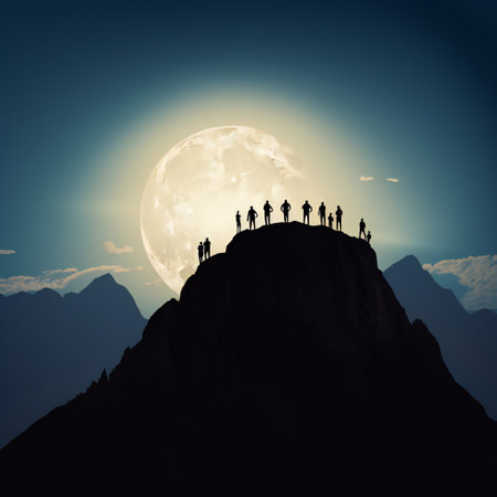 Group of people on top of a mountain at full moon background.の素材