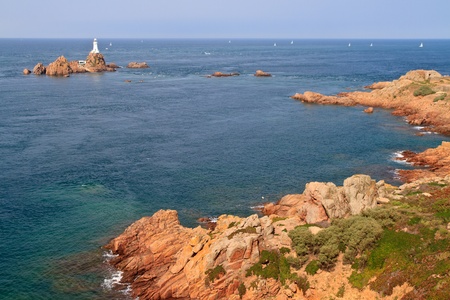 Corbiere Lighthouse and Rocky Coast, Jersey, The Channel Islandsの写真素材