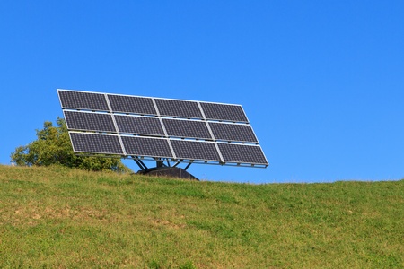 Solar Panel on green meadow (blue sky)