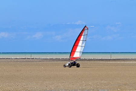 Land sailing on the a beach in Brittany,  France (Char Ã  voile)の写真素材