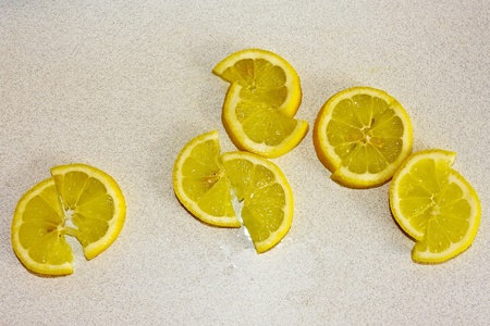 Lemon Slices on white kitchen tableの写真素材