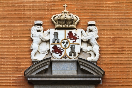 Spanish kings coat of arms on Madrid brick buildingの写真素材