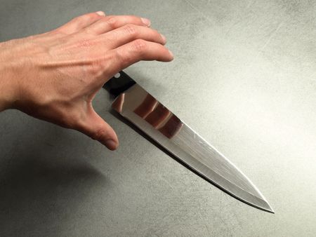 A Hand Grabing sharp knife.の写真素材