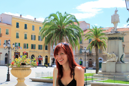 A beautiful girl in front of the Piazza of Italy in Sassari, Sardinia, Italy.の写真素材