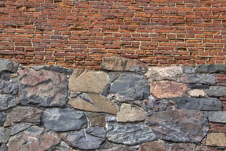 Mixed brick and stone wall texture backgroundの写真素材