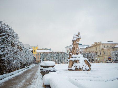 SALZBURG, AUSTRIA - FEB 13, 2018: Roman Statue at Mirabellplatz in Winter season snowのeditorial素材