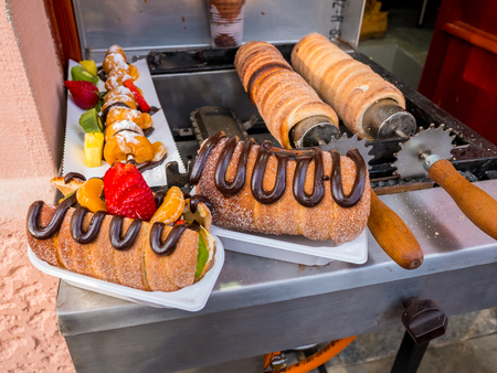Bread sugar sweet Trdelnik - traditional national czech street desert, baking on the street of Prague.の写真素材