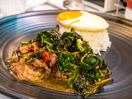 Thai spicy popular famous food basil beef fried rice recipe with fired egg. (Kao Pad Krapao Kai Dao)の写真素材