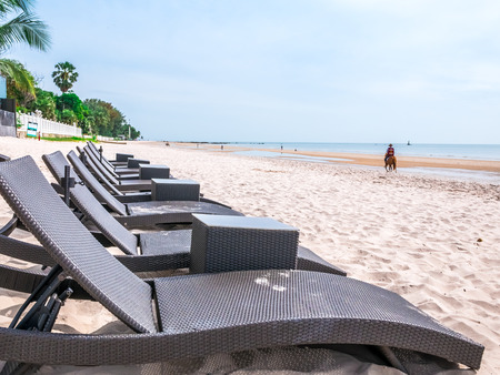 Beautiful beach in Hua Hin Thailand. Chairs on the white sandy beach near the sea. Summer holiday and vacation concept for tourism.の写真素材