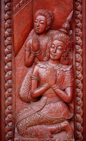 Carved wooden windows in Thai temples.の写真素材