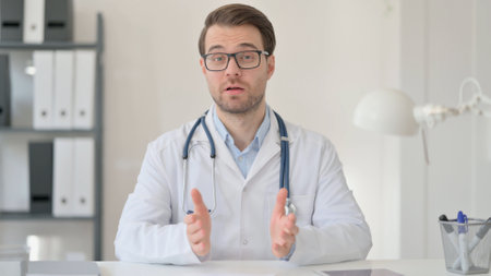 Male Doctor Talking on Video Callの写真素材