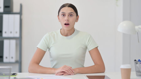 Young Latin Woman Reacting to Loss, Failureの写真素材