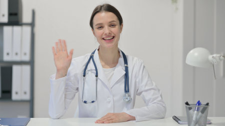 Online Video Chat by Female Doctor in clinicの写真素材