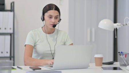Call Center Woman Working on Laptopの写真素材
