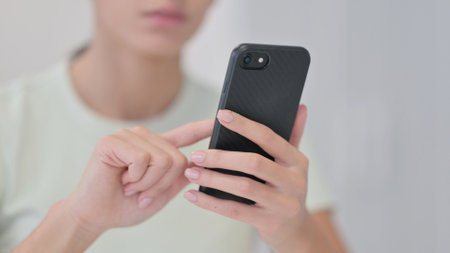 Close Up of Female Hand Using Smartphone