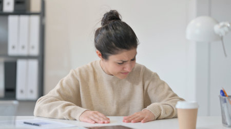 Upset Young Indian Woman Sitting in Office, Problemsの写真素材