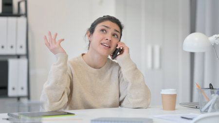 Phone Talk, Young Indian Woman Discussing Workの写真素材