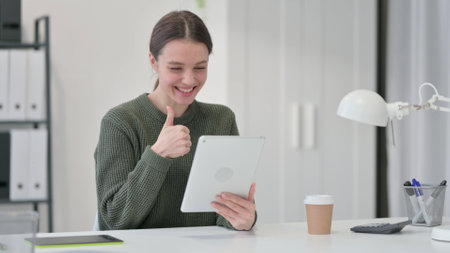 Excited Young Woman Doing Video Chat,の写真素材