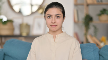 Portrait of Indian Woman Looking at Camera at Homeの写真素材